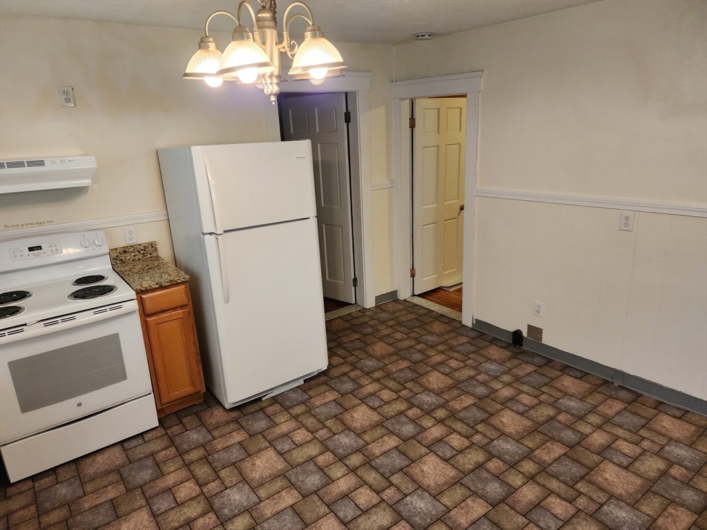 1260 Grafton Street Worcester, MA 01604 - Photo 12 of 42 a refrigerator freezer sitting inside of a kitchen