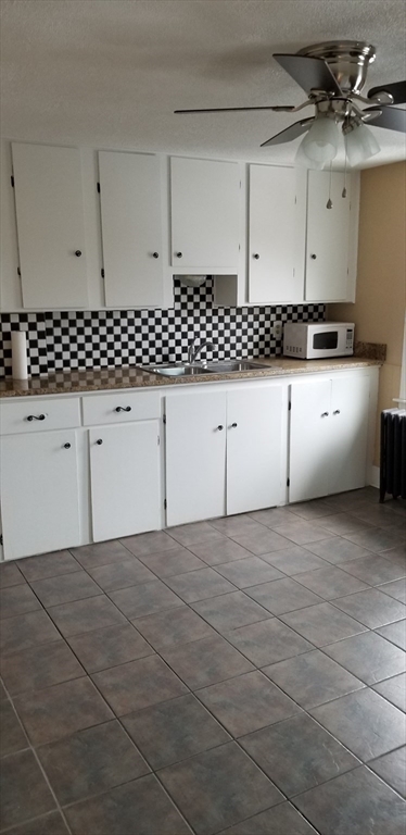 1260 Grafton Street Worcester, MA 01604 - Photo 16 of 42 a view of kitchen with white cabinets