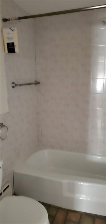 1260 Grafton Street Worcester, MA 01604 - Photo 23 of 42 a bathroom with a bathtub and a shower