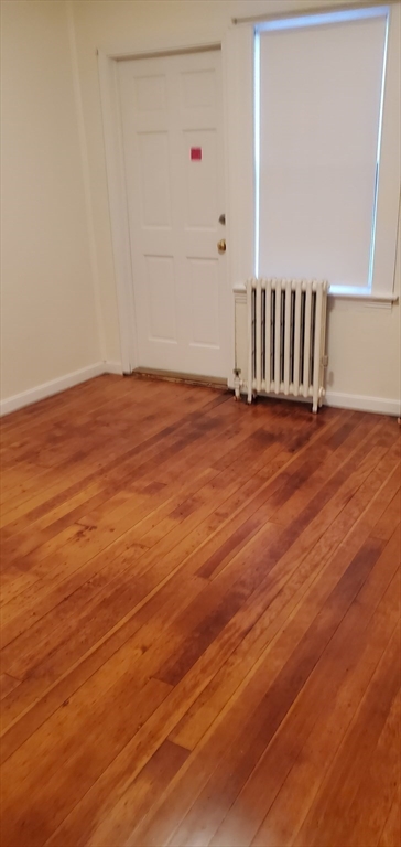 1260 Grafton Street Worcester, MA 01604 - Photo 26 of 42 a view of an empty room with wooden floor