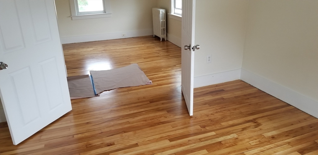 1260 Grafton Street Worcester, MA 01604 - Photo 29 of 42 an empty room with wooden floor