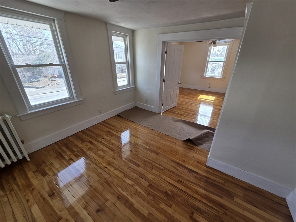 1260 Grafton Street Worcester, MA 01604 - Photo 32 of 42 a view of an empty room with wooden floor and a window