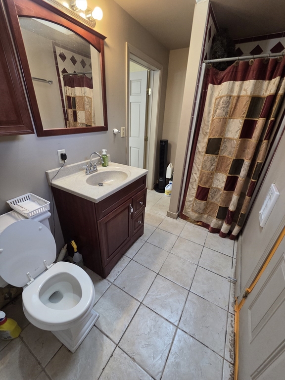 1260 Grafton Street Worcester, MA 01604 - Photo 42 of 42 a bathroom with a sink and a mirror
