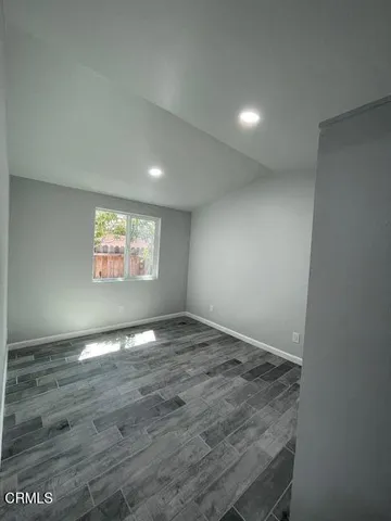 a view of balcony with wooden floor