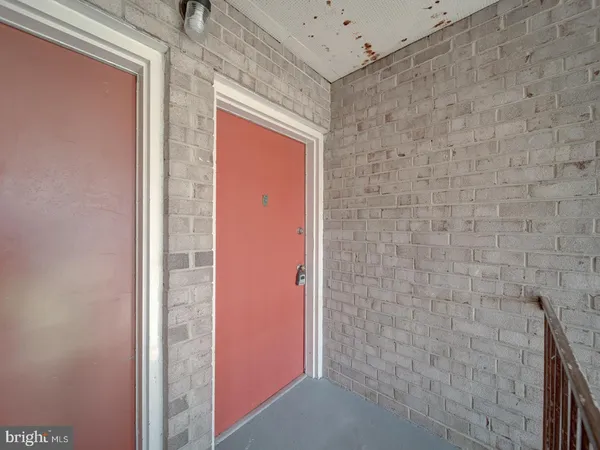 a bathroom with a shower and a sink