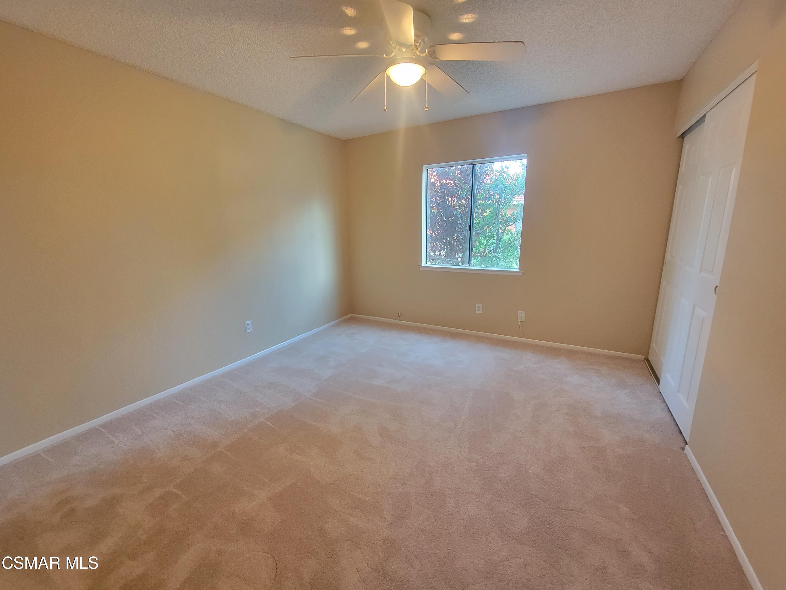 1200 Pasteur Drive Lancaster, CA 93535 - Photo 12 of 32 an empty room with a window and a fan