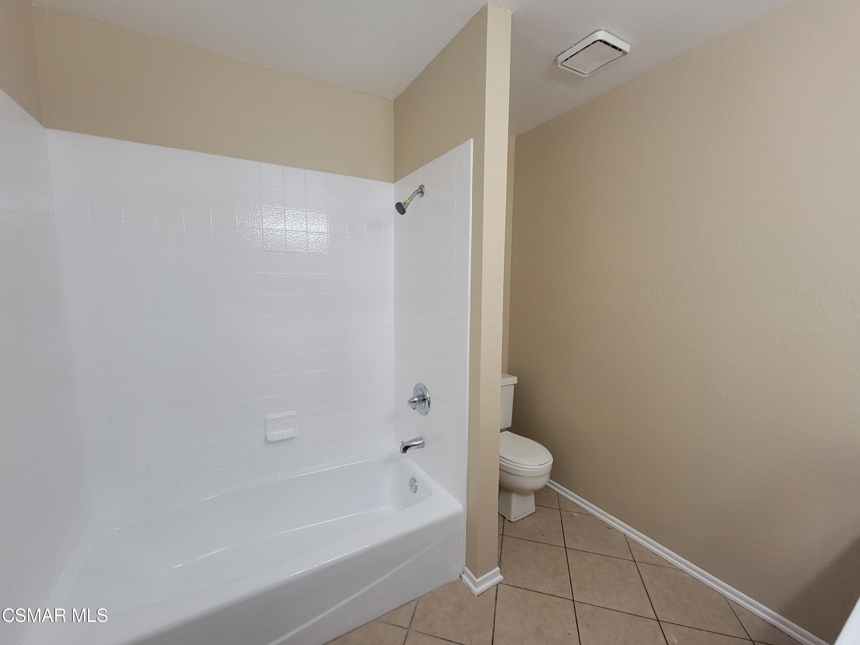1200 Pasteur Drive Lancaster, CA 93535 - Photo 16 of 32 a bathroom with a bathtub and a shower