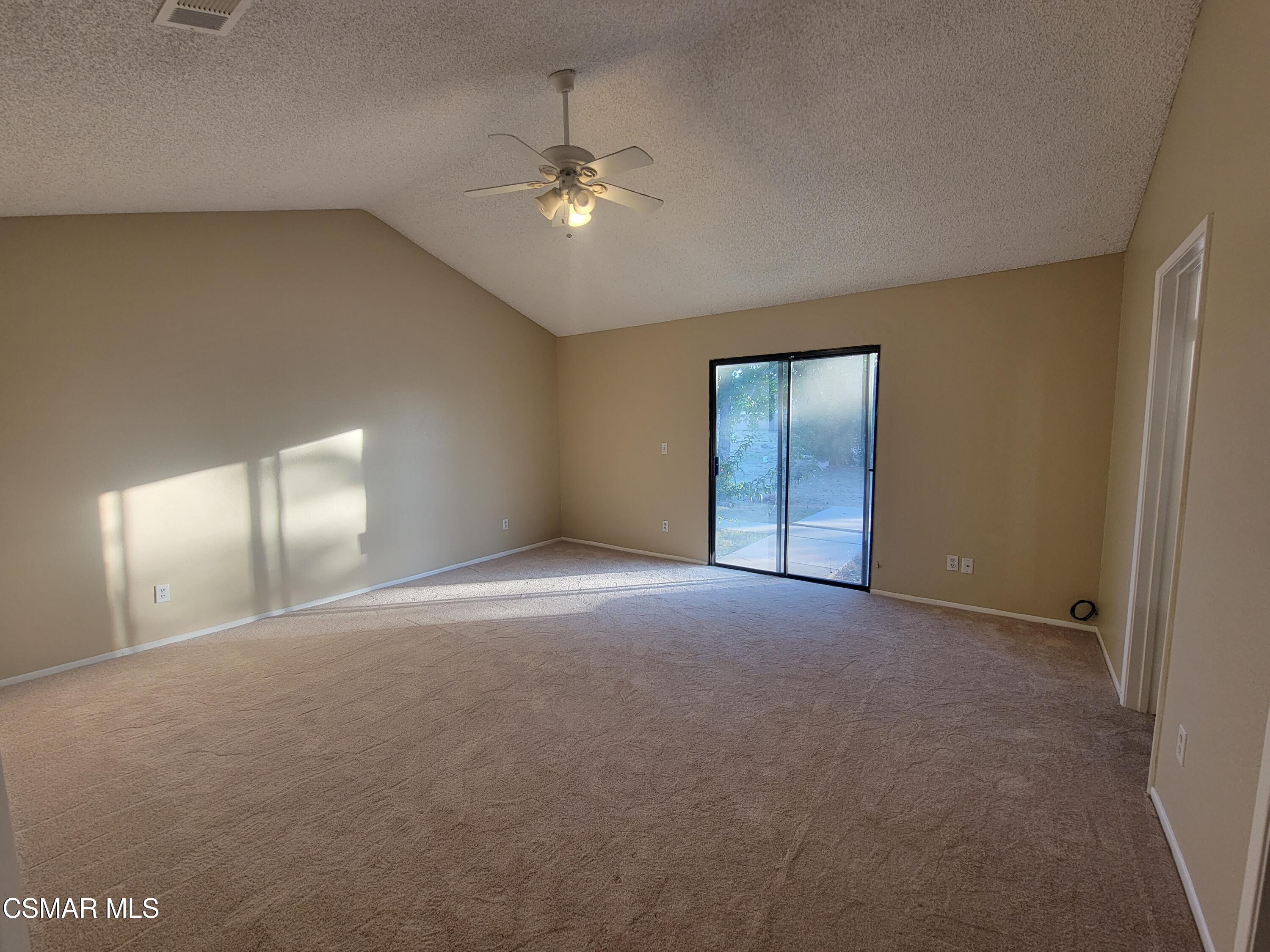 1200 Pasteur Drive Lancaster, CA 93535 - Photo 17 of 32 a view of an empty room with a chandelier fan