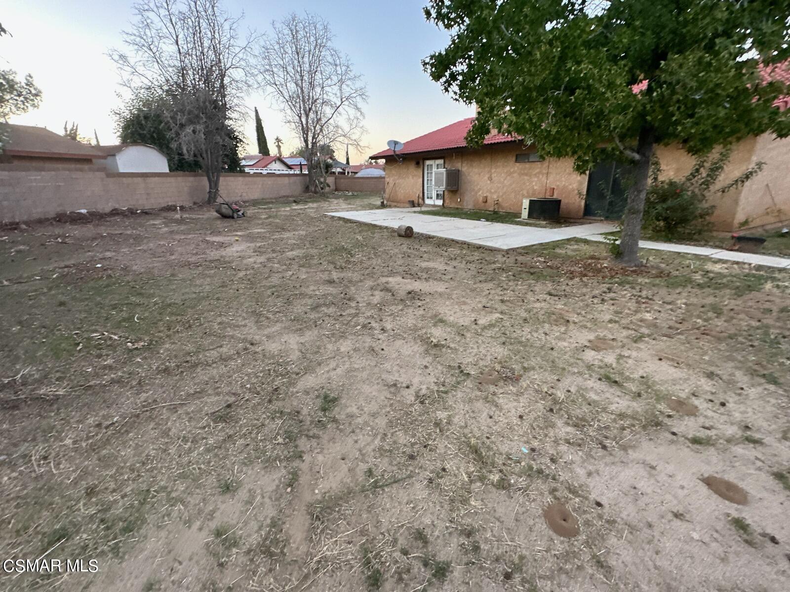 1200 Pasteur Drive Lancaster, CA 93535 - Photo 28 of 32 a white house that has a tree on the side of it