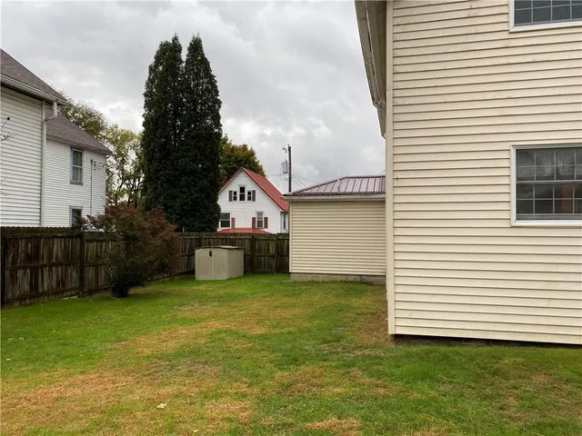 a view of a backyard with a small cabin