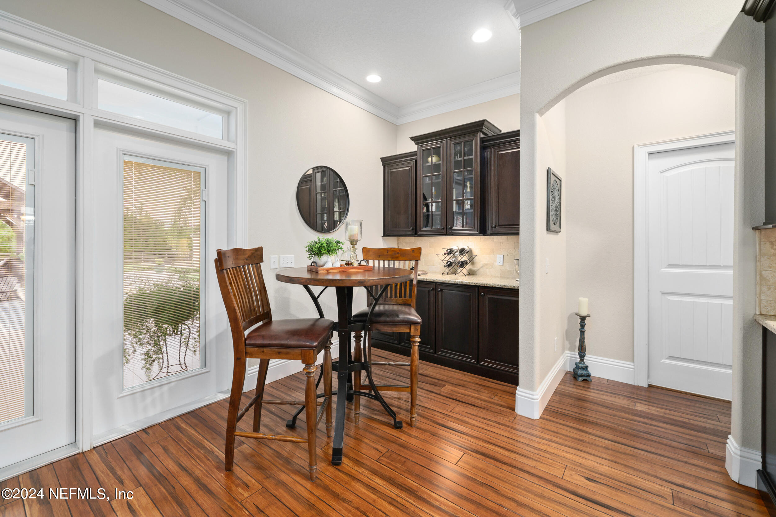55278 Bartram Trail Callahan, FL 32011 - Photo 17 of 88 a view of a dining room with furniture and wooden floor