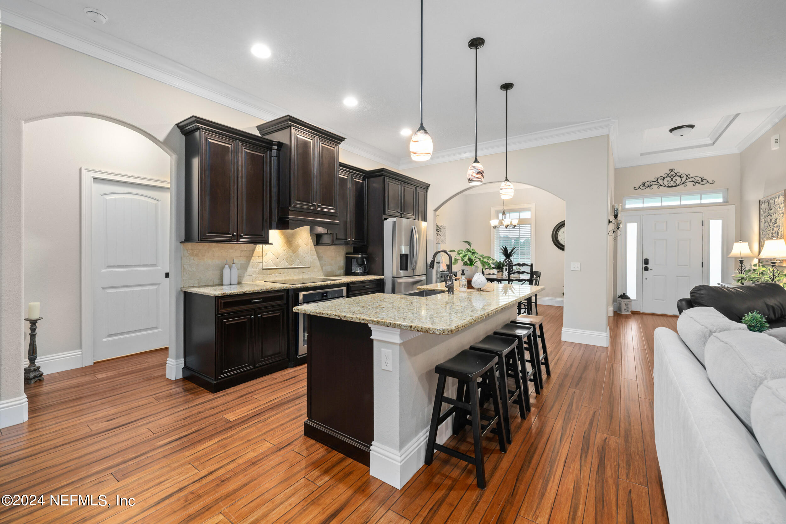 55278 Bartram Trail Callahan, FL 32011 - Photo 27 of 88 a kitchen with granite countertop a sink appliances and cabinets