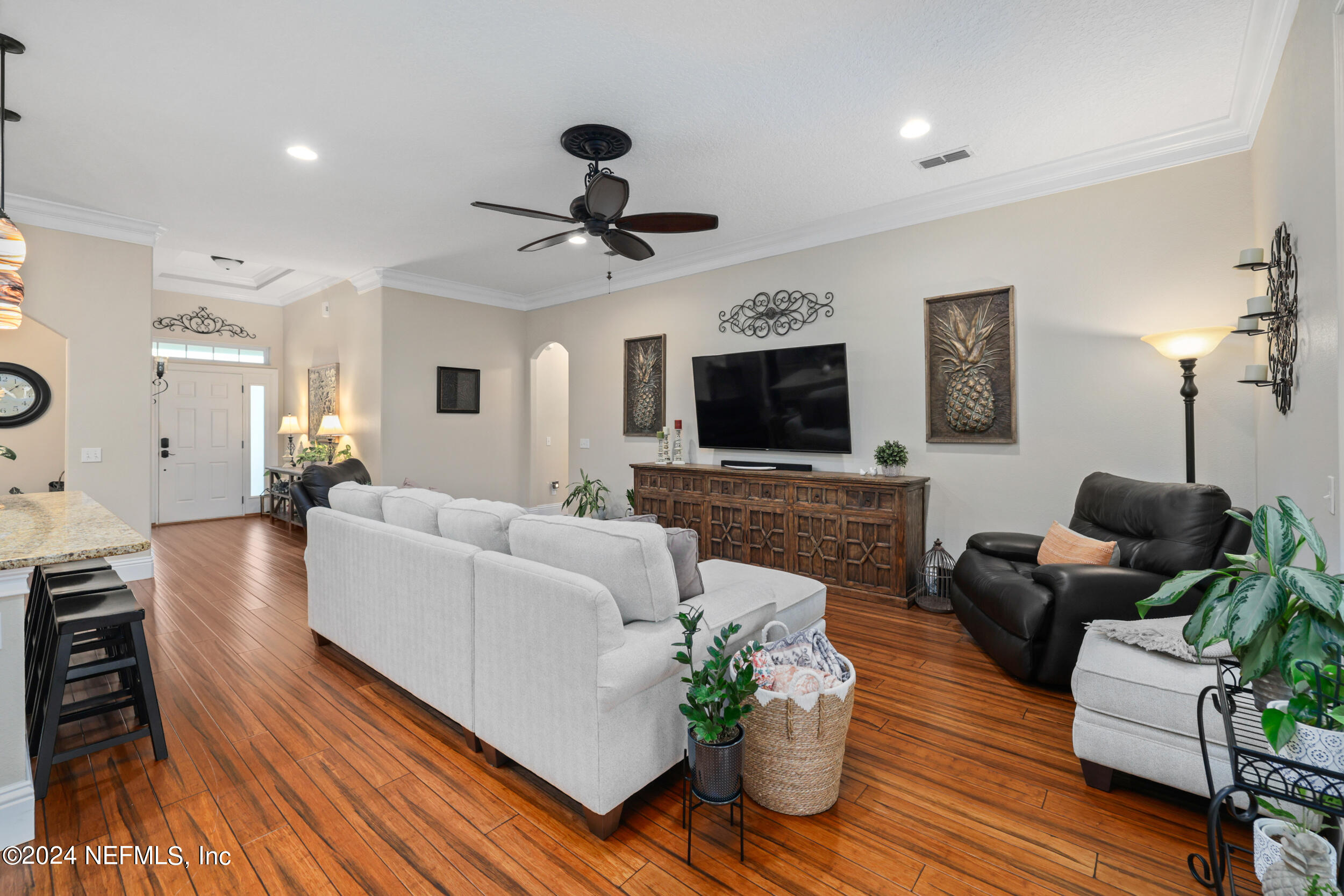 55278 Bartram Trail Callahan, FL 32011 - Photo 30 of 88 a living room with furniture a flat screen tv and a fireplace