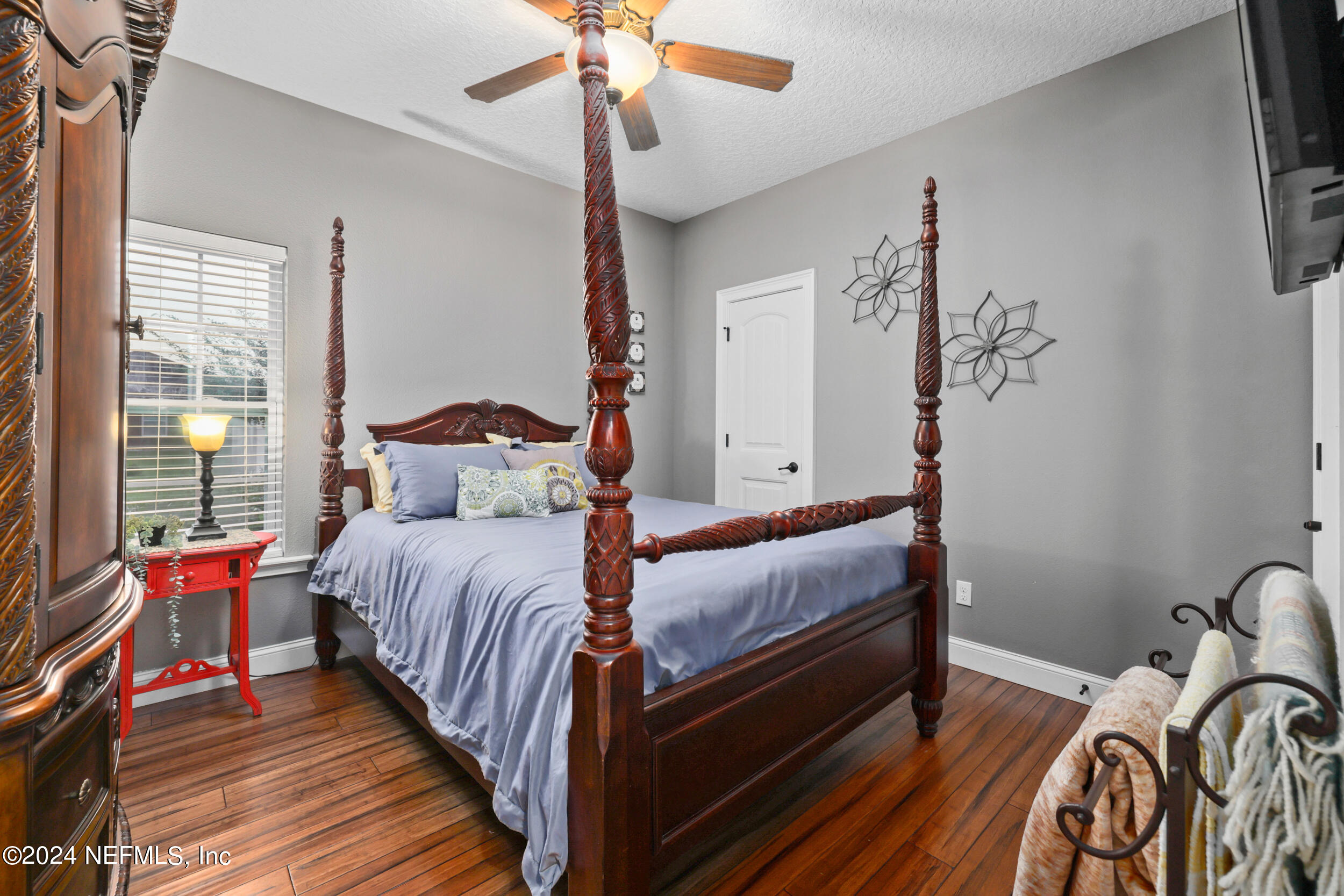 55278 Bartram Trail Callahan, FL 32011 - Photo 33 of 88 a bedroom with bed and wooden floor