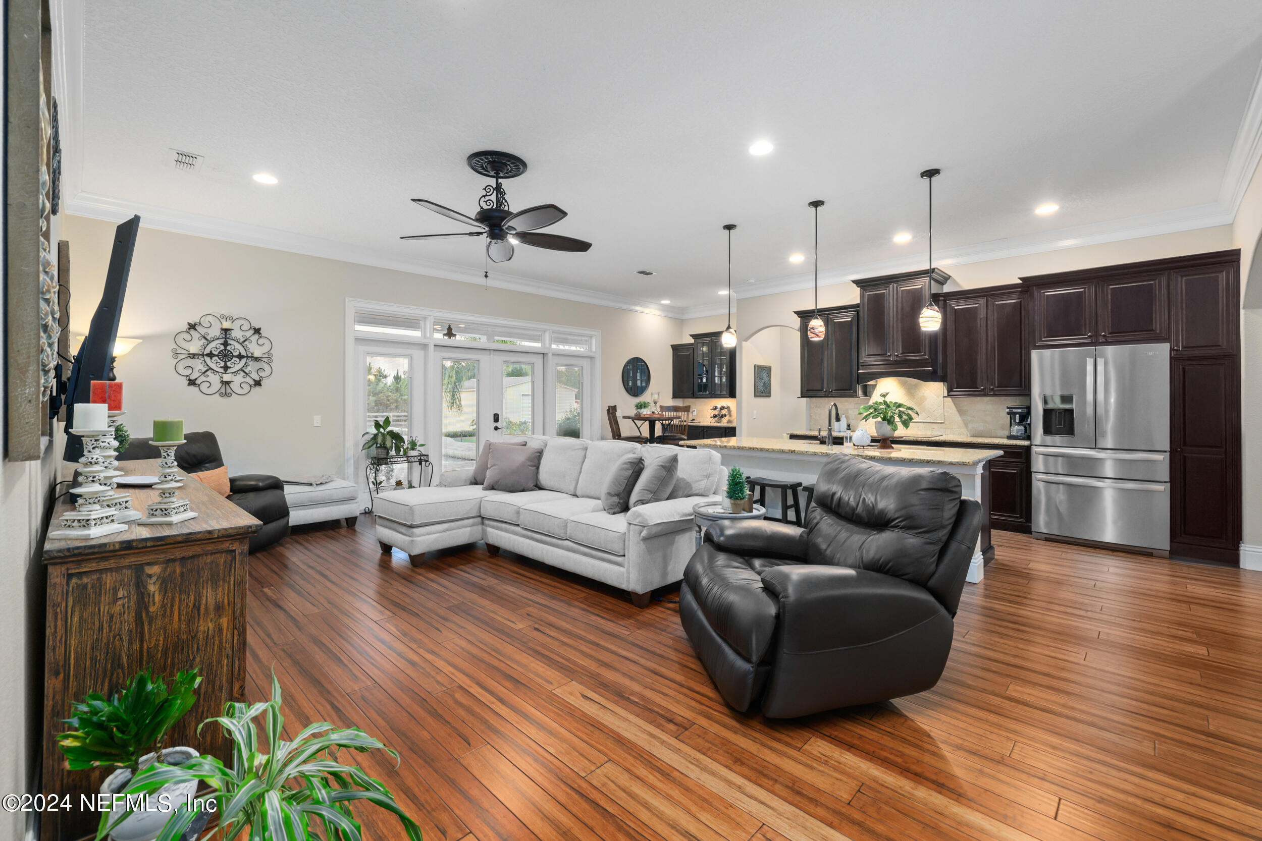 55278 Bartram Trail Callahan, FL 32011 - Photo 39 of 88 a living room with furniture kitchen and a wooden floor