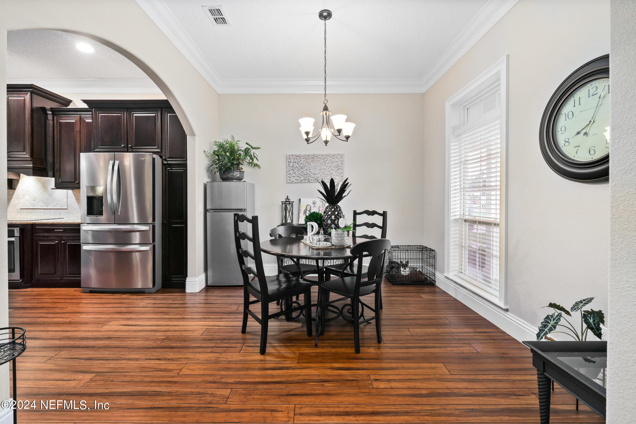 55278 Bartram Trail Callahan, FL 32011 - Photo 40 of 88 a view of a dining room with furniture window and wooden floor