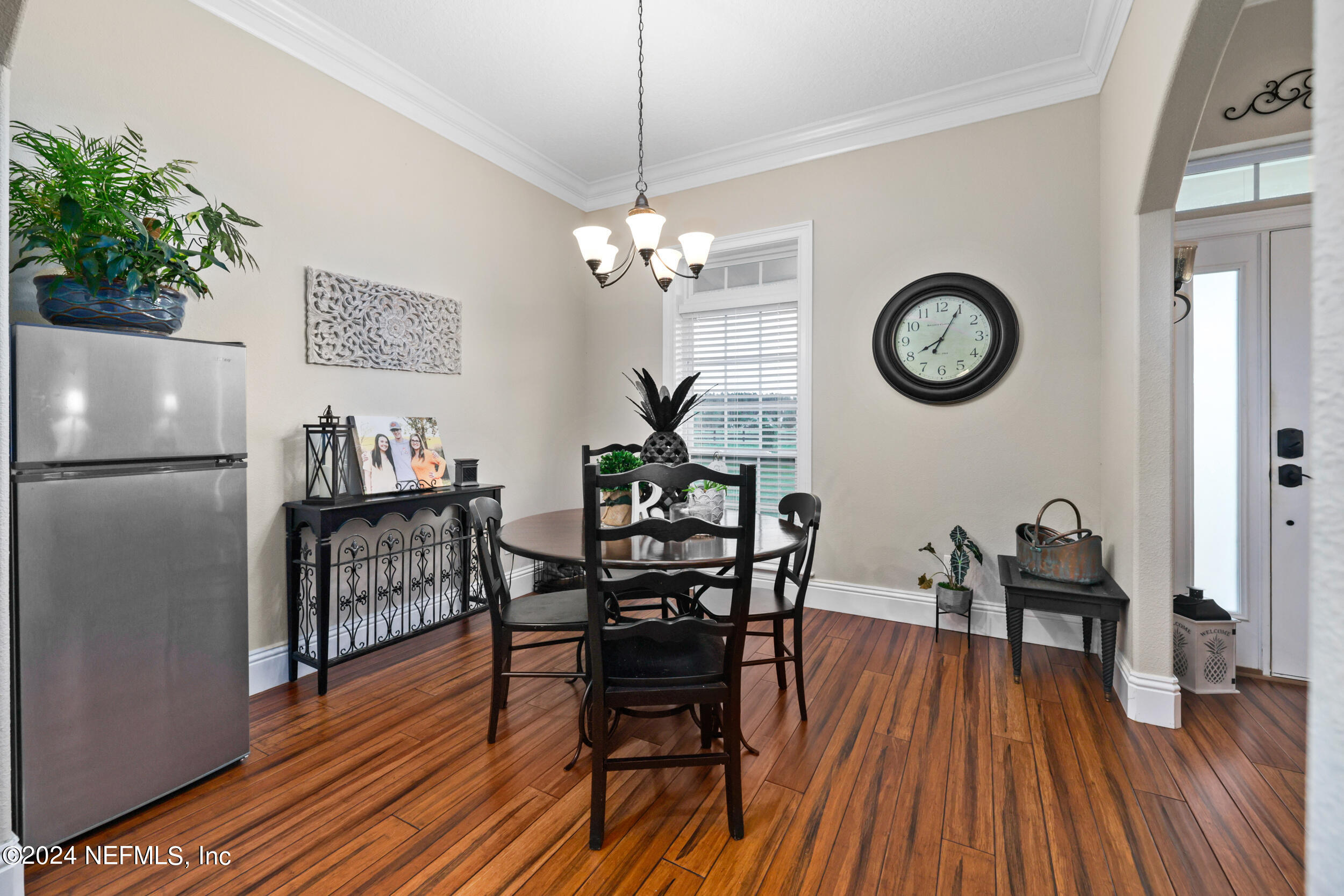 55278 Bartram Trail Callahan, FL 32011 - Photo 41 of 88 a view of a dining room with furniture and wooden floor
