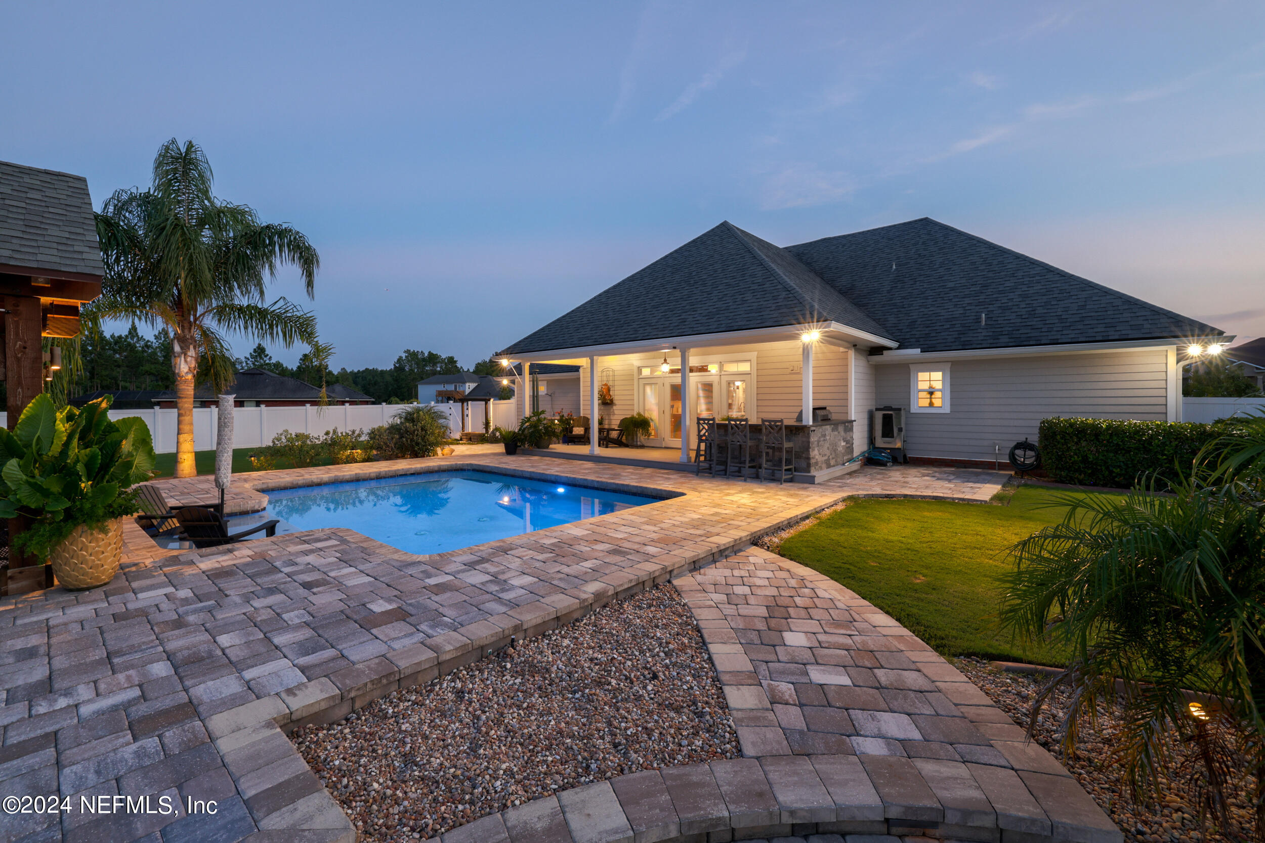 55278 Bartram Trail Callahan, FL 32011 - Photo 53 of 88 a view of swimming pool and trees in the background