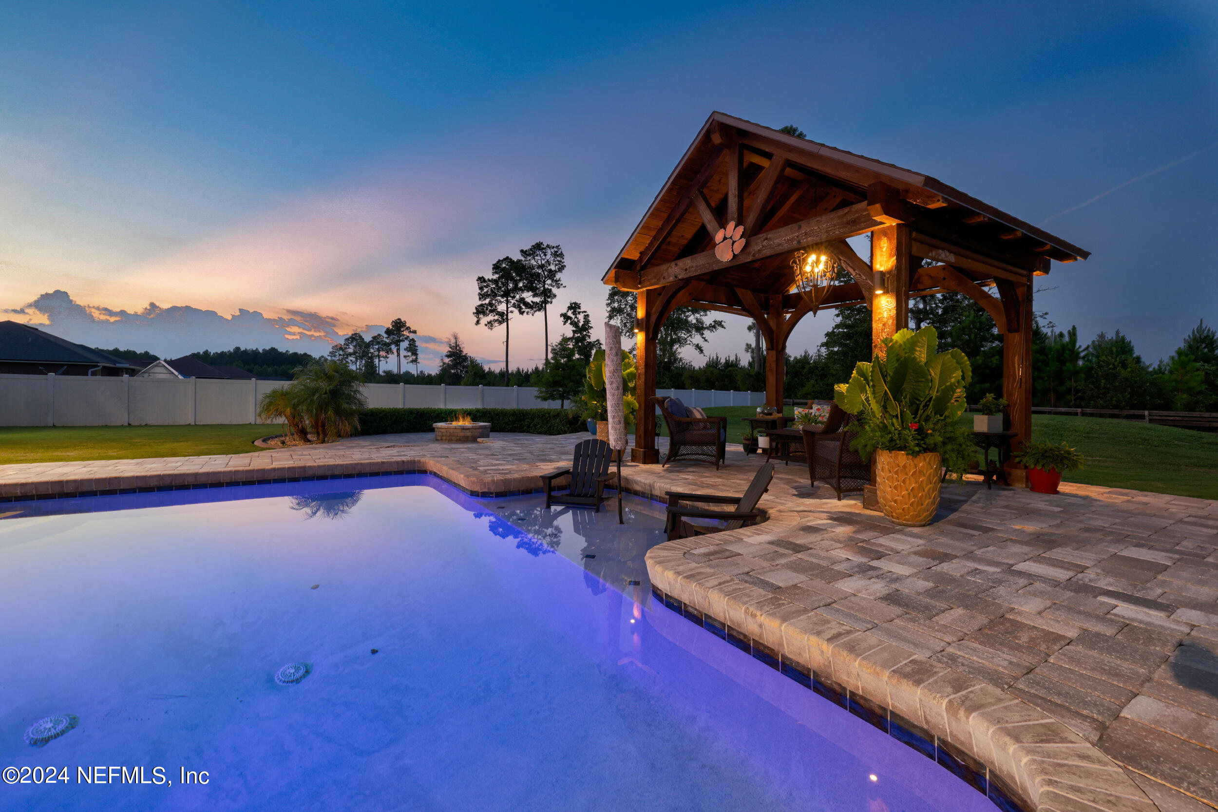 55278 Bartram Trail Callahan, FL 32011 - Photo 56 of 88 a view of a house with swimming pool and sitting area