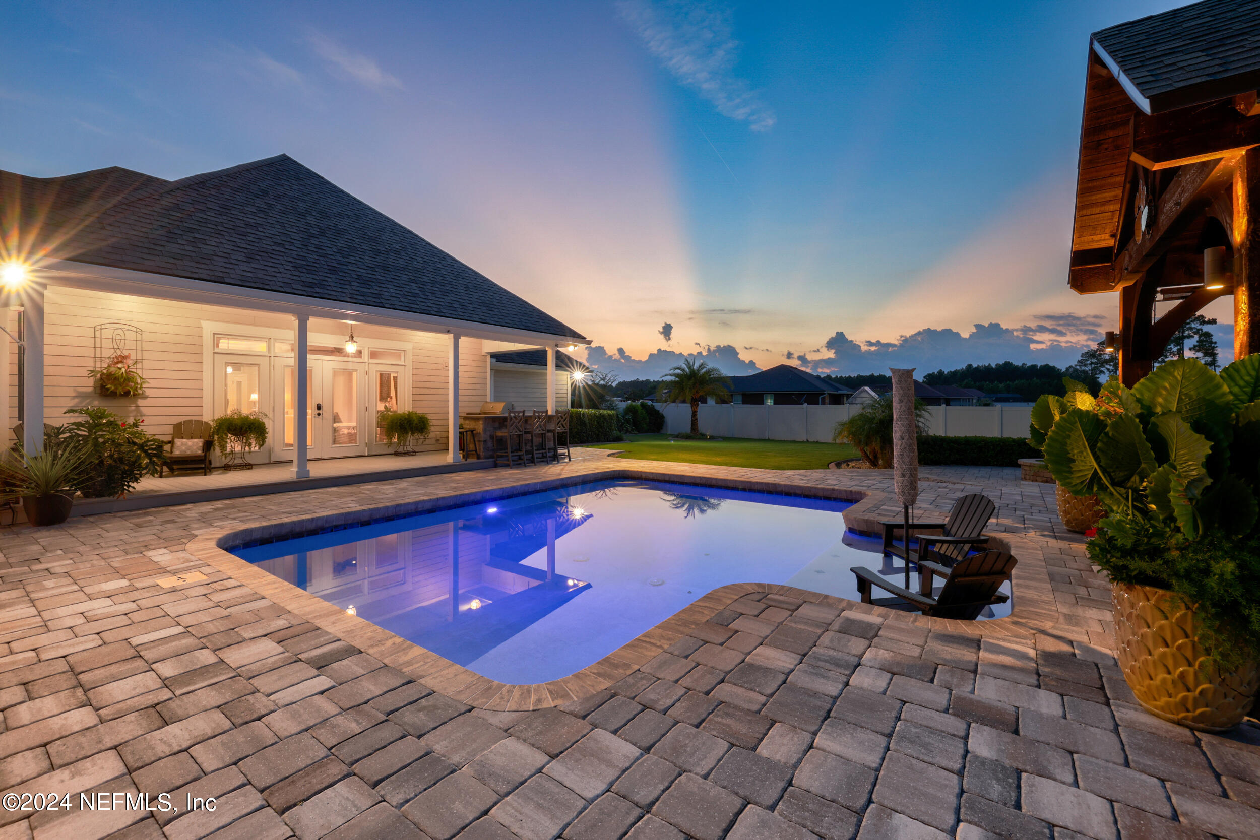 55278 Bartram Trail Callahan, FL 32011 - Photo 57 of 88 a swimming pool with outdoor seating and yard