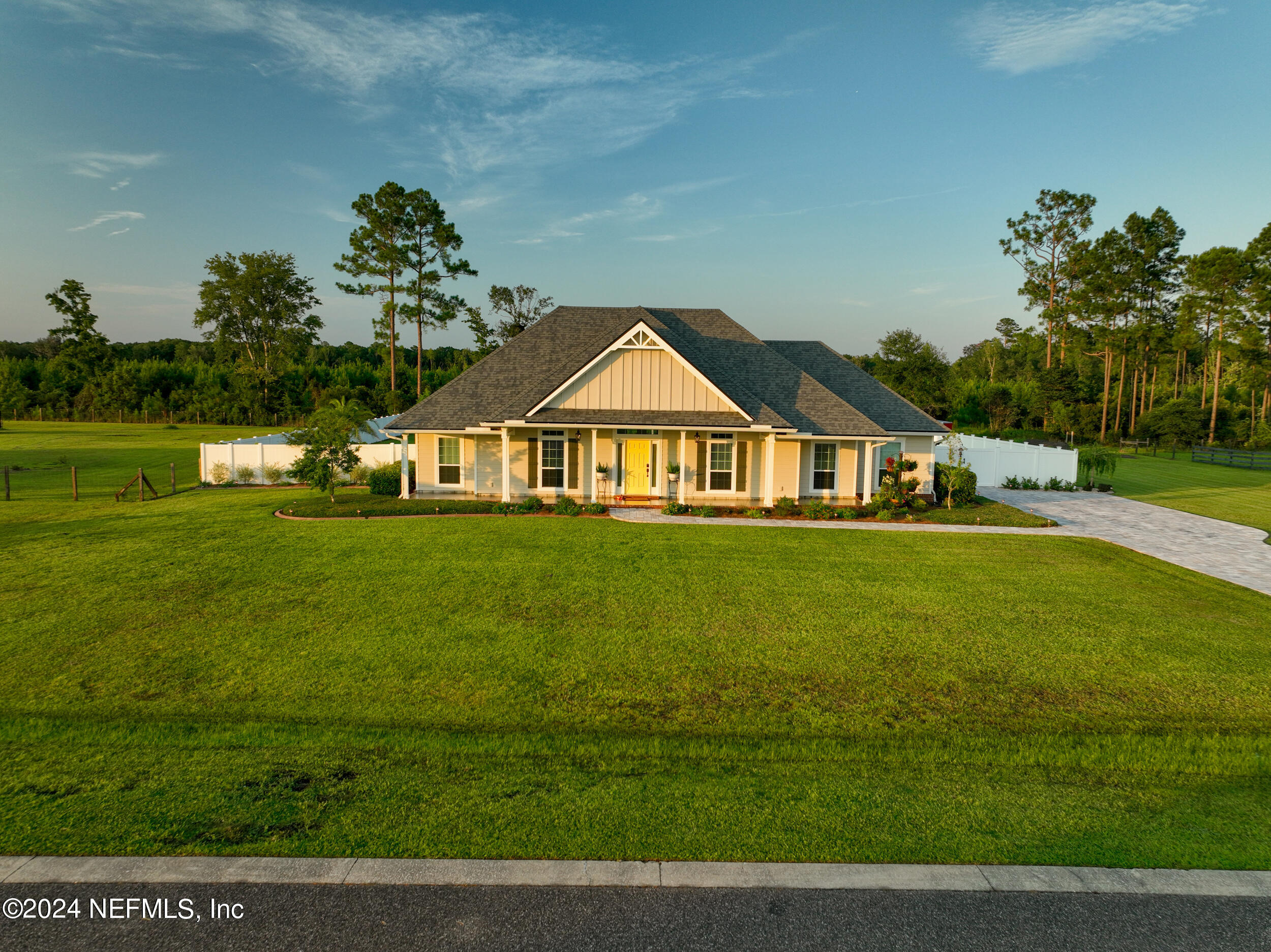 55278 Bartram Trail Callahan, FL 32011 - Photo 73 of 88 a front view of a house with garden
