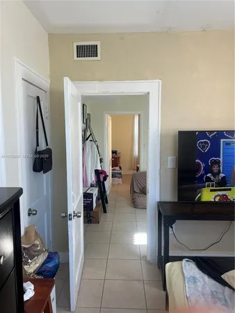 a living room with furniture and a lamp