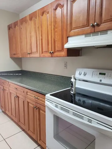 a close view of a sink and cabinets