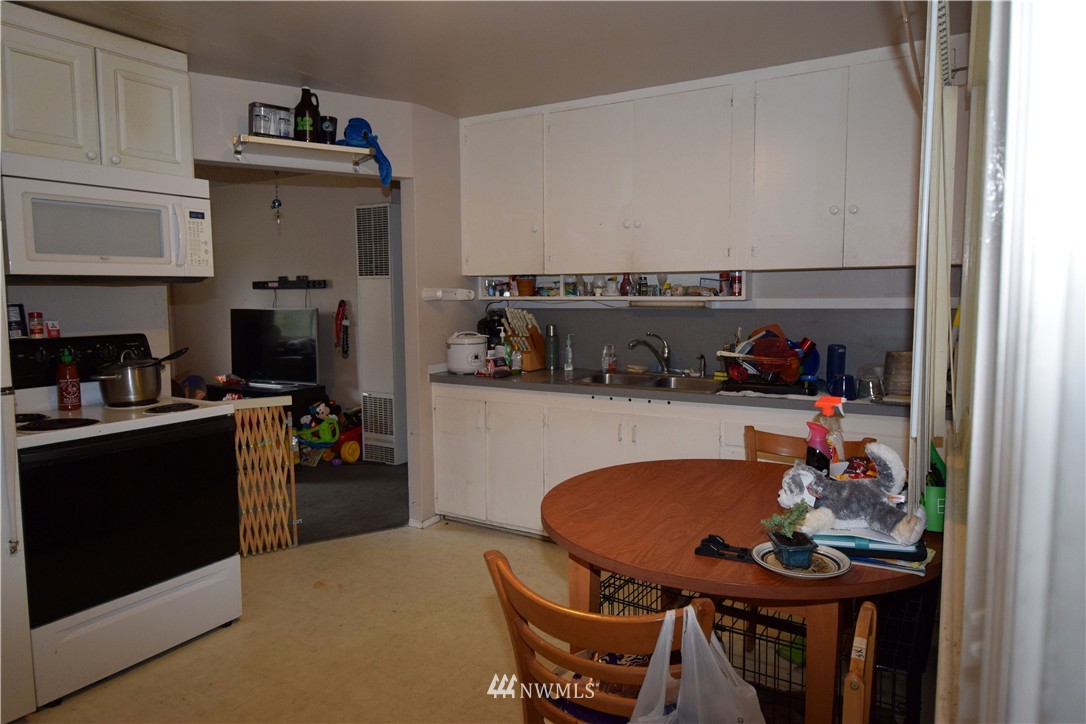 620 Index Avenue Northeast Renton, WA 98056 - Photo 2 of 17 a kitchen with a table and chairs in it