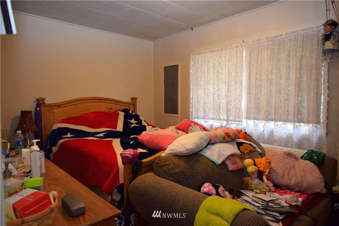 620 Index Avenue Northeast Renton, WA 98056 - Photo 11 of 17 a bedroom with two bed and a couch