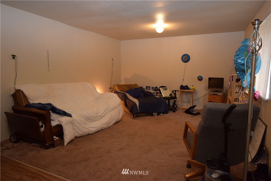 620 Index Avenue Northeast Renton, WA 98056 - Photo 13 of 17 a bed room with a bed and a chair