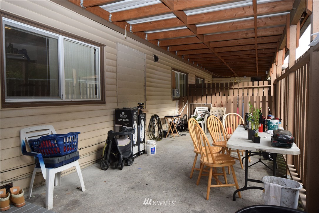 620 Index Avenue Northeast Renton, WA 98056 - Photo 14 of 17 a view of a chairs and tables in patio