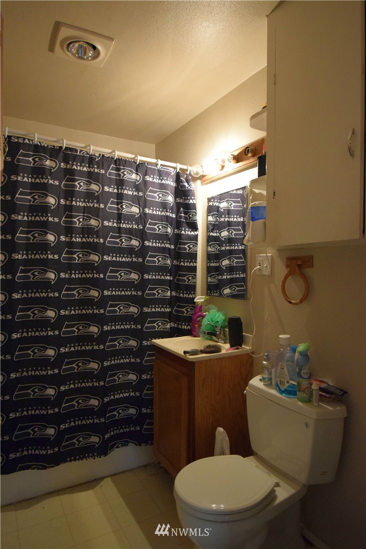 620 Index Avenue Northeast Renton, WA 98056 - Photo 4 of 17 a bathroom with a toilet a sink and a shower