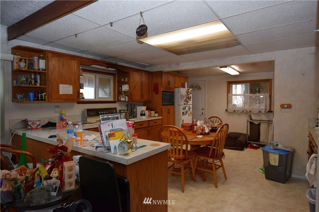 620 Index Avenue Northeast Renton, WA 98056 - Photo 7 of 17 a view of a dining room with furniture and a kitchen