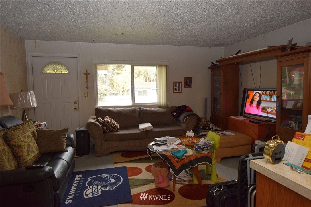 620 Index Avenue Northeast Renton, WA 98056 - Photo 8 of 17 a living room with furniture and a flat screen tv