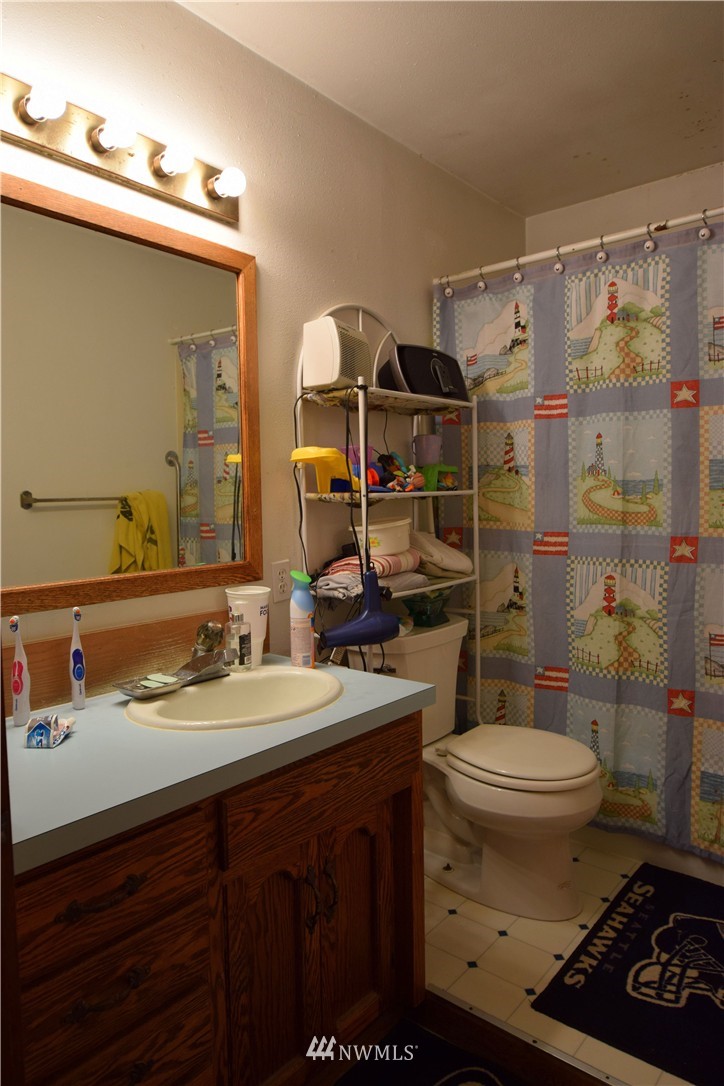 620 Index Avenue Northeast Renton, WA 98056 - Photo 9 of 17 a bathroom with a sink toilet and shower