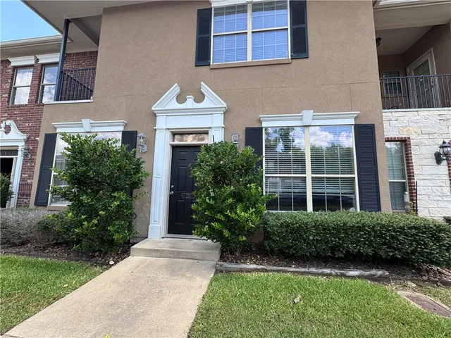 a kitchen with a stove a refrigerator and a sink