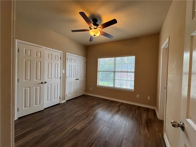 a picture of a wall with a red bench