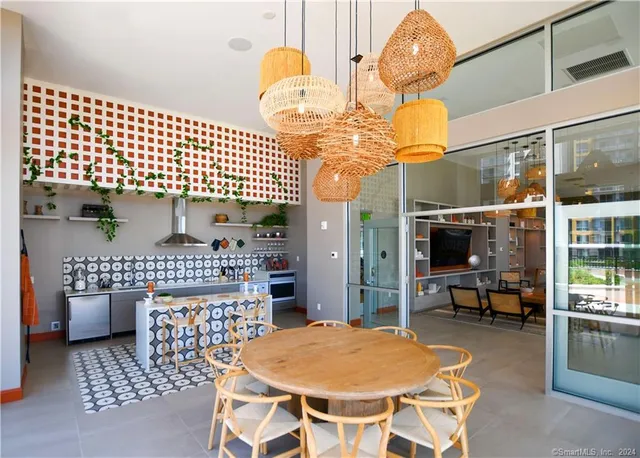 a dining room with a table and chairs