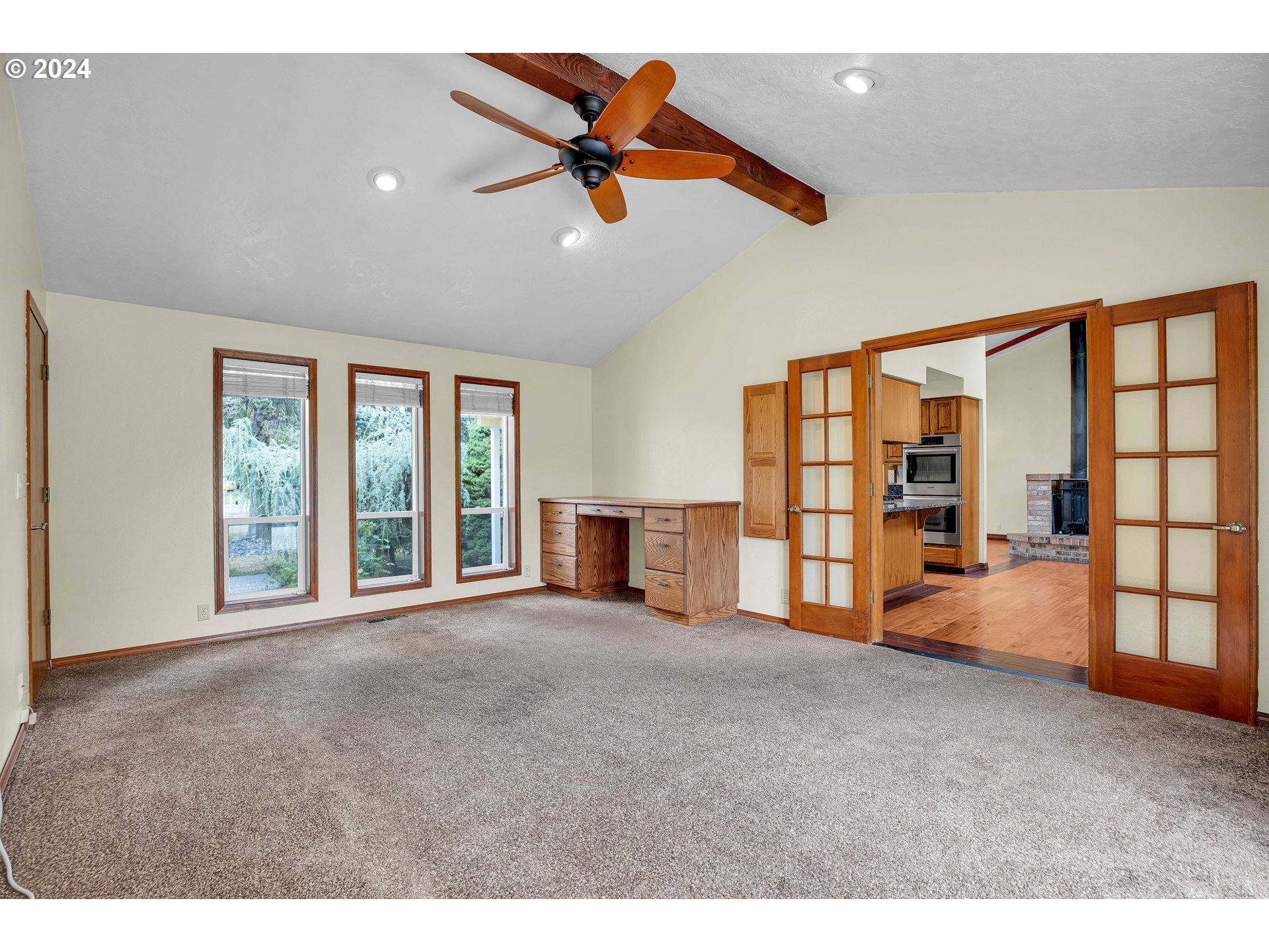 28930 Southeast Powell Valley Road Gresham, OR 97080 - Photo 14 of 38 a view of an empty room with a window and a kitchen