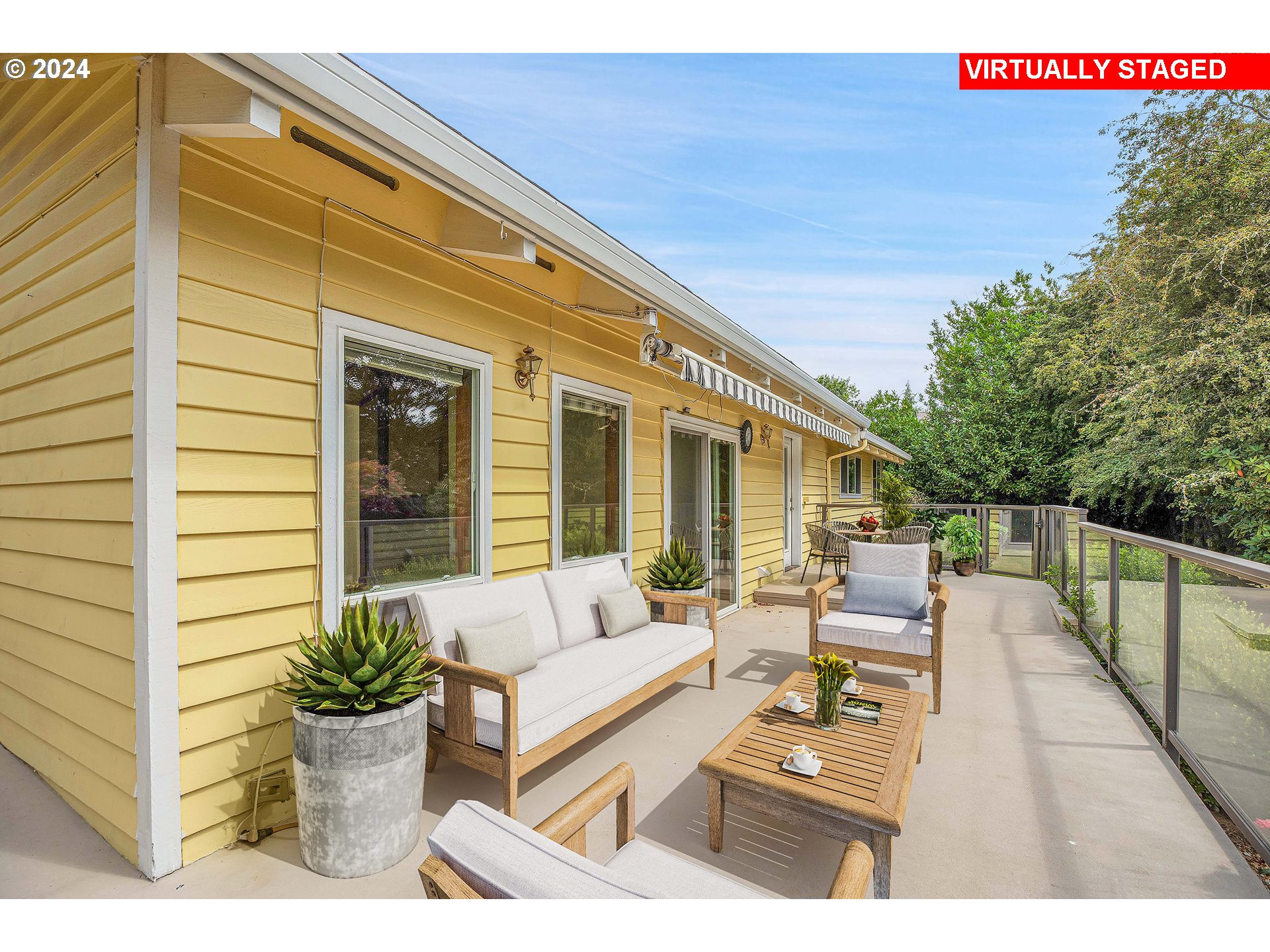 28930 Southeast Powell Valley Road Gresham, OR 97080 - Photo 28 of 38 a view of a patio with couches table and chairs and potted plants