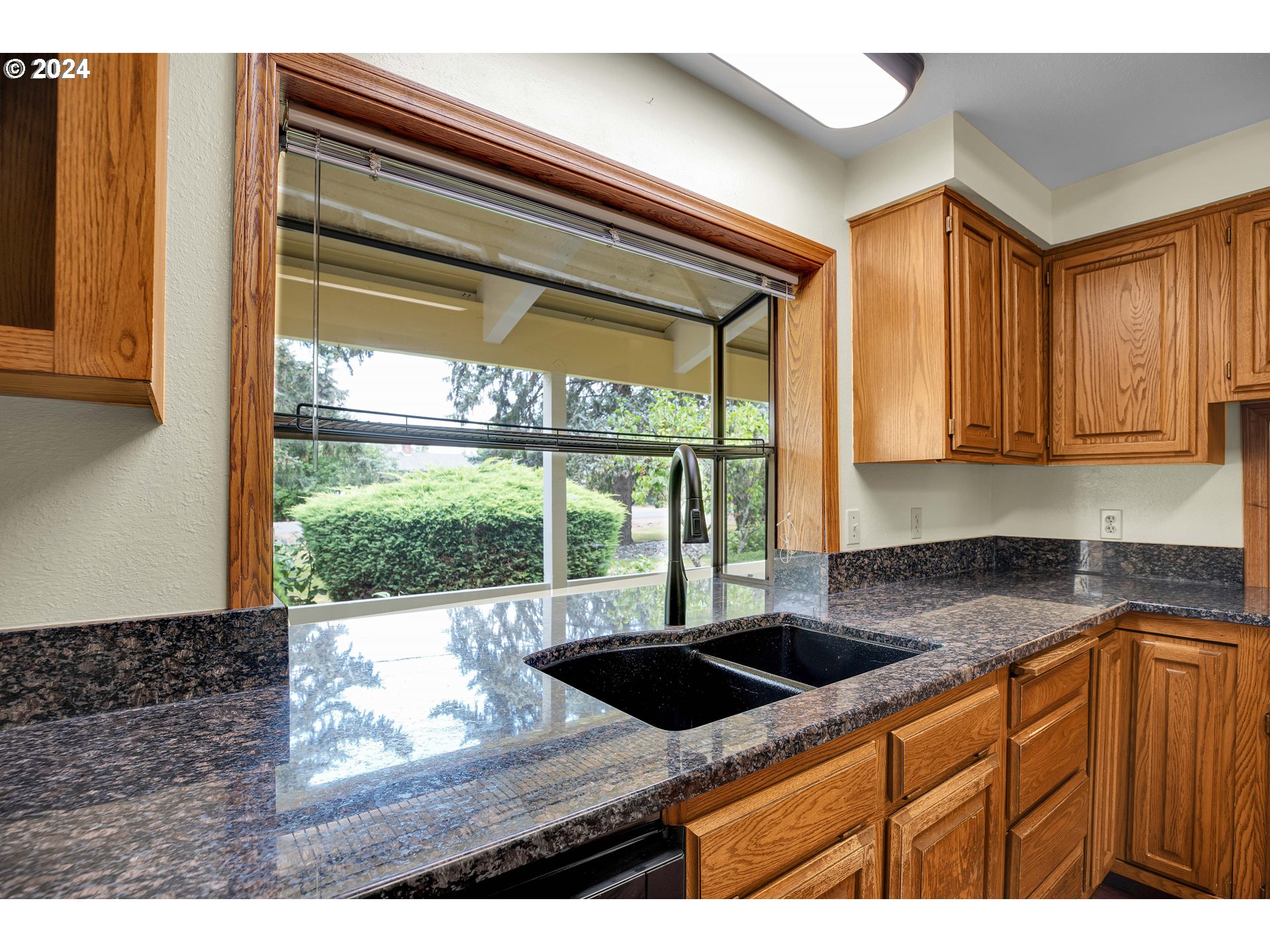 28930 Southeast Powell Valley Road Gresham, OR 97080 - Photo 8 of 38 a kitchen that has a sink and a window
