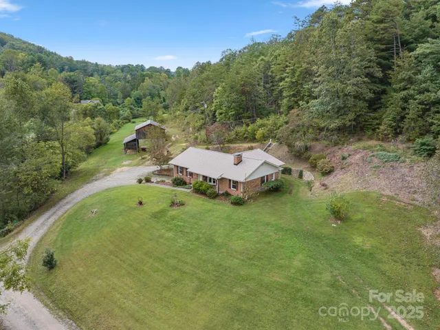 an aerial view of a house with pool