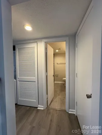 a view of a bathroom with a glass door and shower