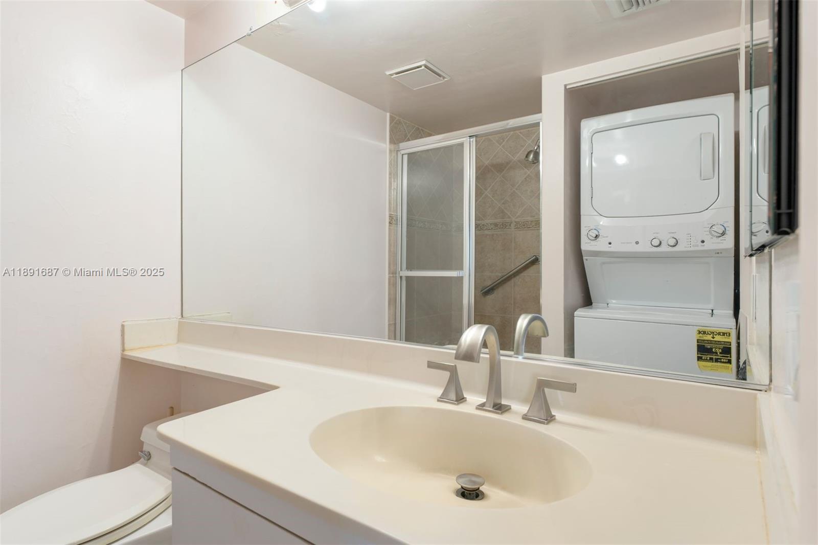 1000 Quayside Terrace, Unit PH9 Miami, FL 33138 - Photo 14 of 27 a bathroom with a sink and a mirror