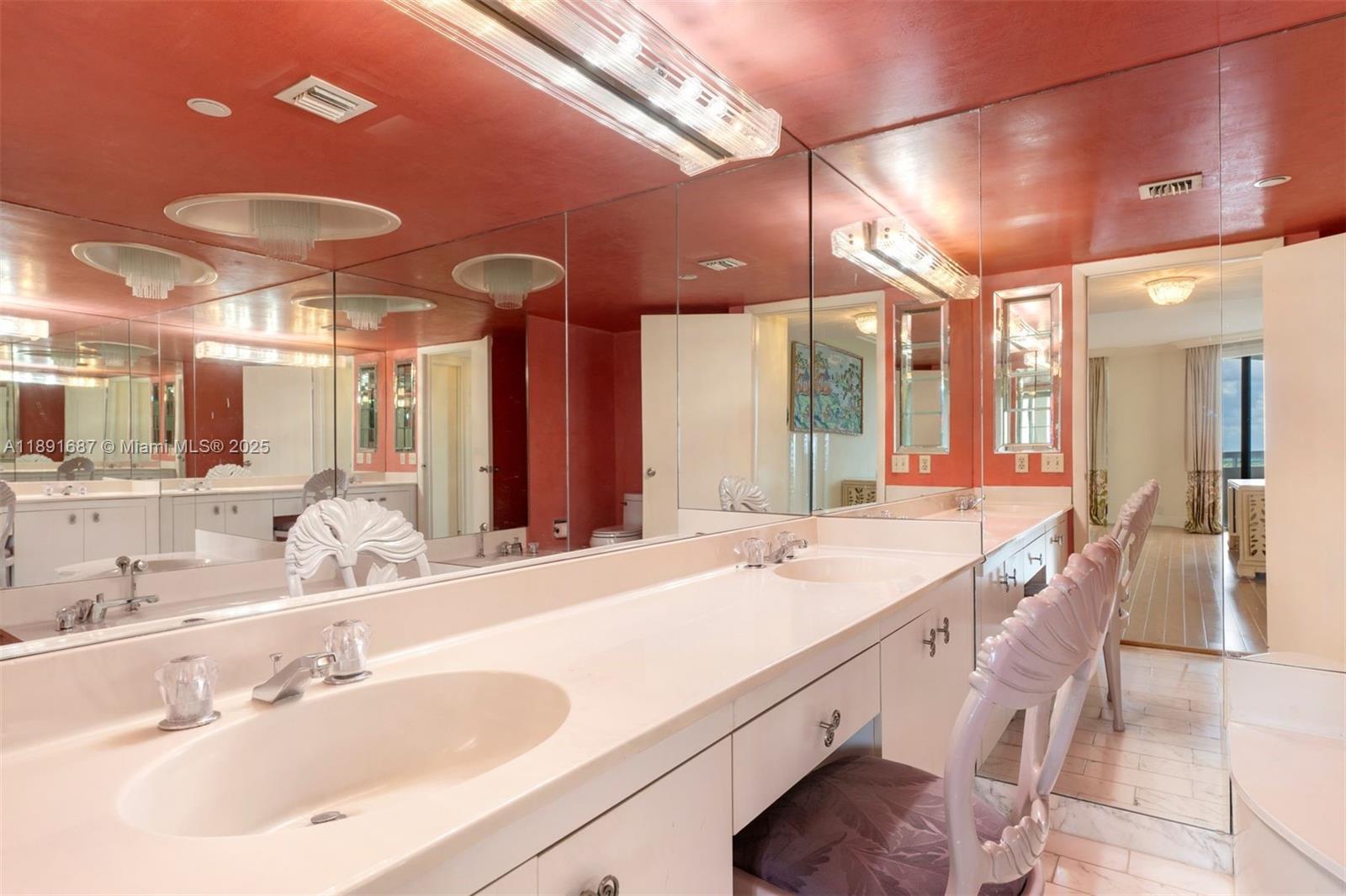 1000 Quayside Terrace, Unit PH9 Miami, FL 33138 - Photo 21 of 27 a spacious bathroom with a granite countertop sink a large mirror and a shower