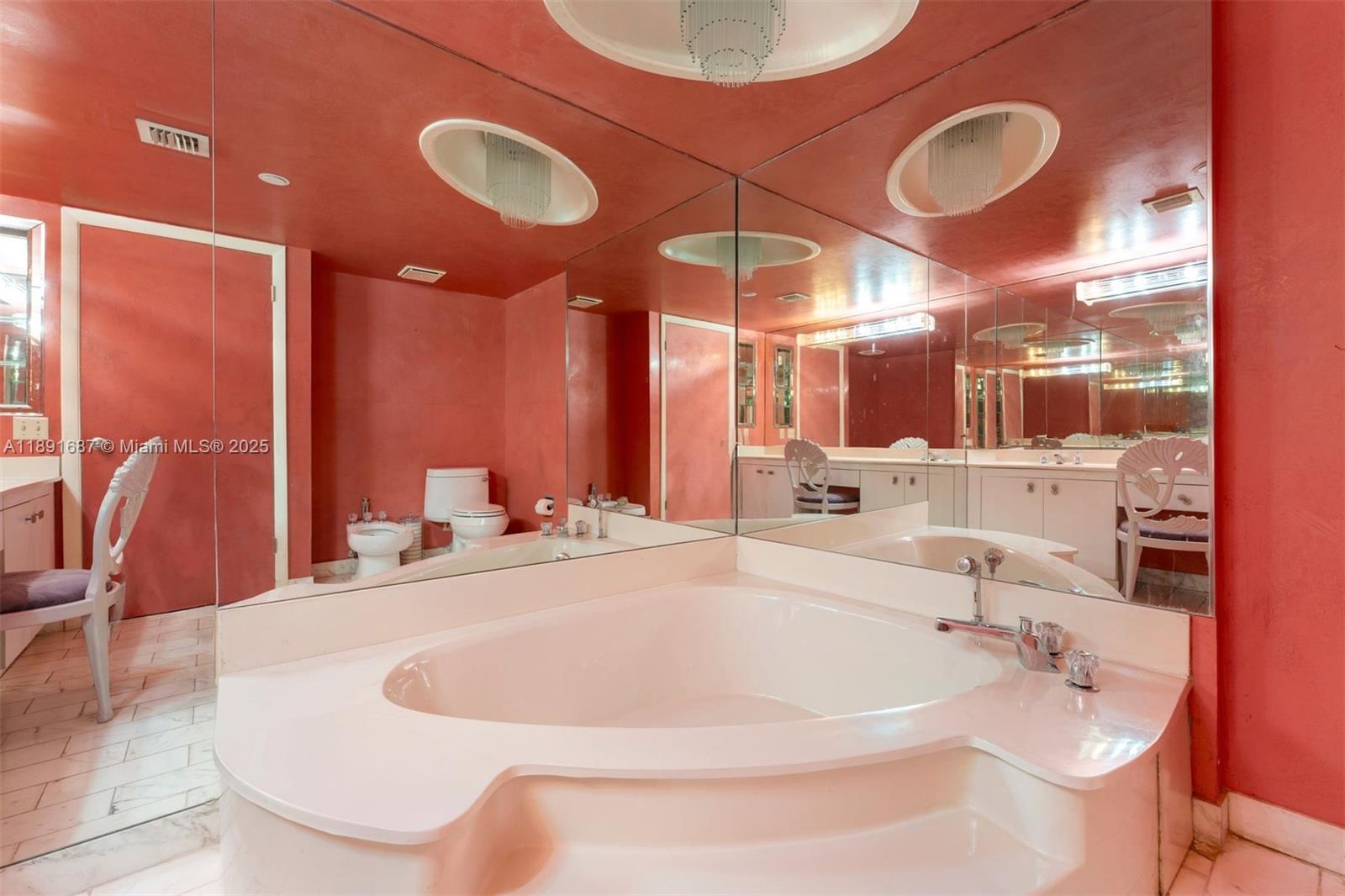 1000 Quayside Terrace, Unit PH9 Miami, FL 33138 - Photo 22 of 27 a bathroom with a bathtub and shower