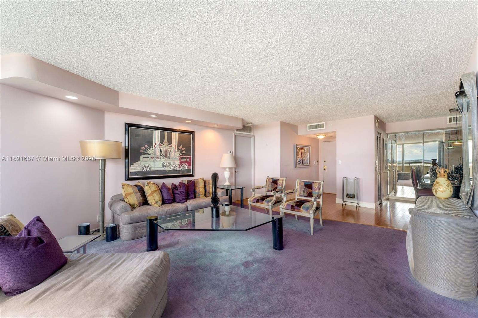 1000 Quayside Terrace, Unit PH9 Miami, FL 33138 - Photo 4 of 27 a living room with furniture and a large window