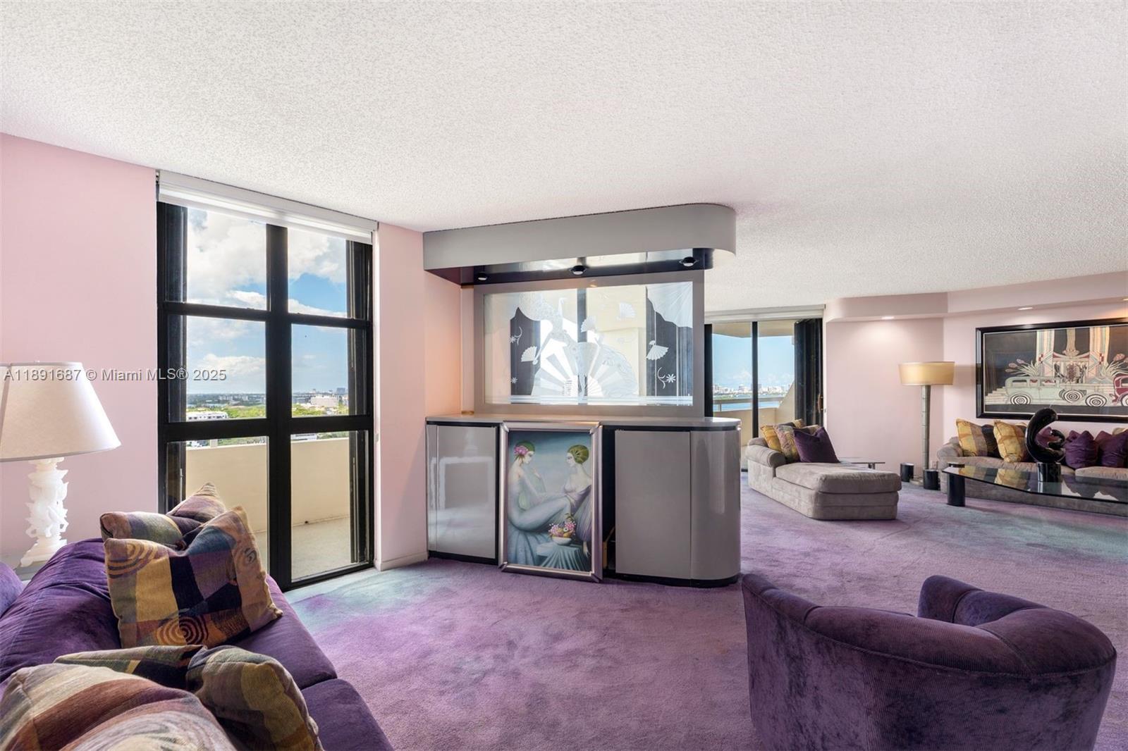 1000 Quayside Terrace, Unit PH9 Miami, FL 33138 - Photo 7 of 27 a living room with furniture and a window