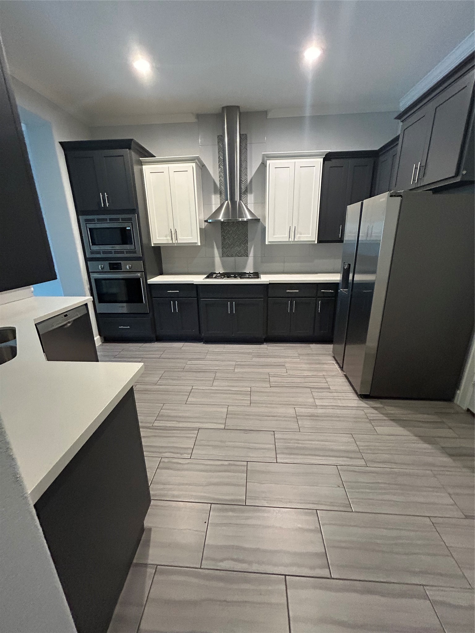 1211 Marconi Street Houston, TX 77019 - Photo 12 of 42 a kitchen with stainless steel appliances a refrigerator and a stove top oven