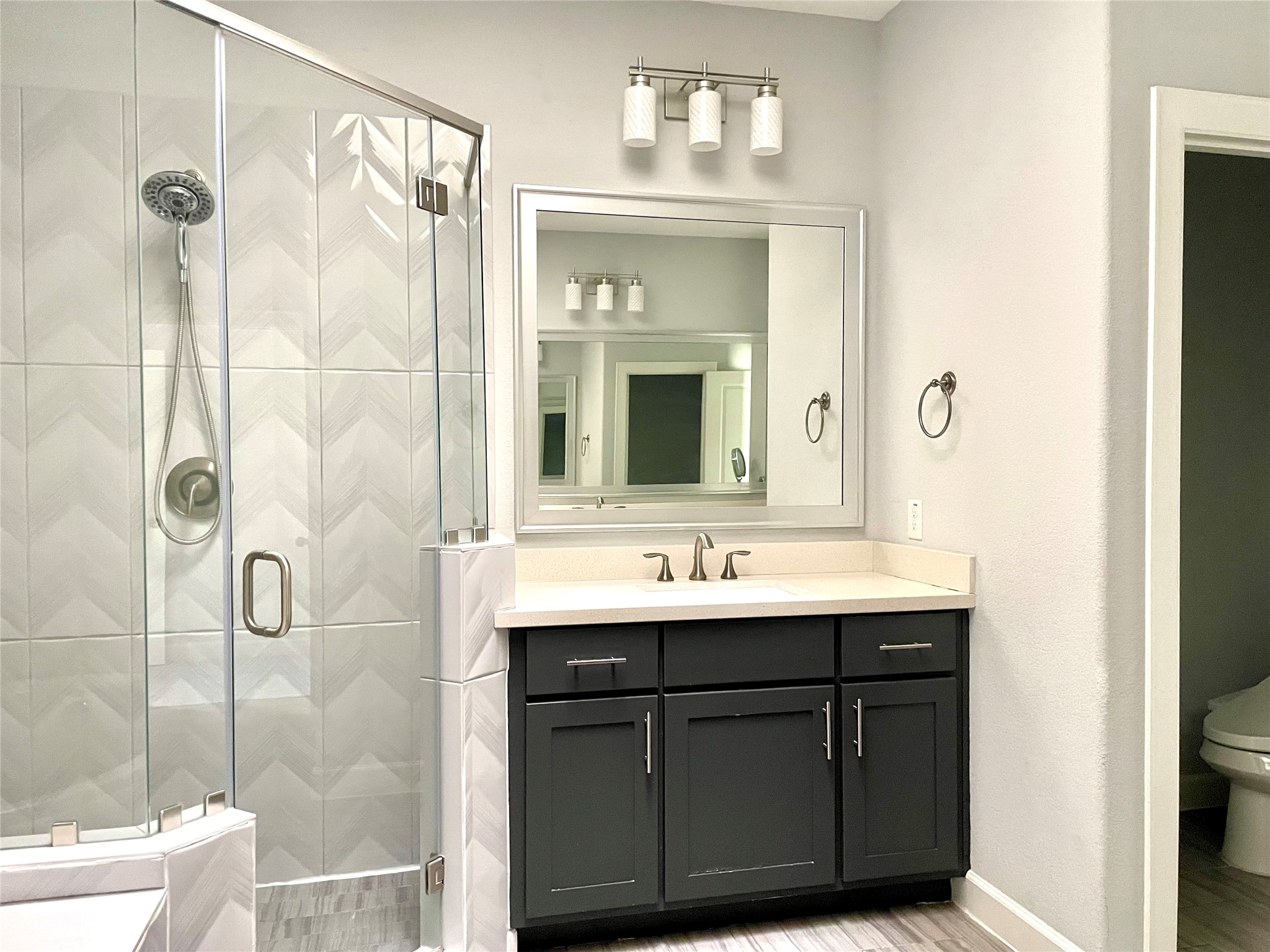 1211 Marconi Street Houston, TX 77019 - Photo 22 of 42 a bathroom with a double vanity sink mirror and shower